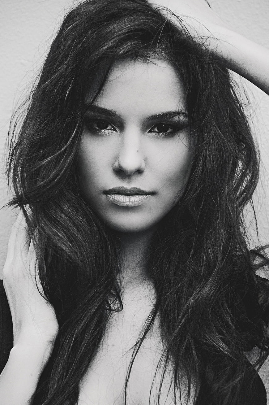 Black and white portrait of a young woman with long dark hair