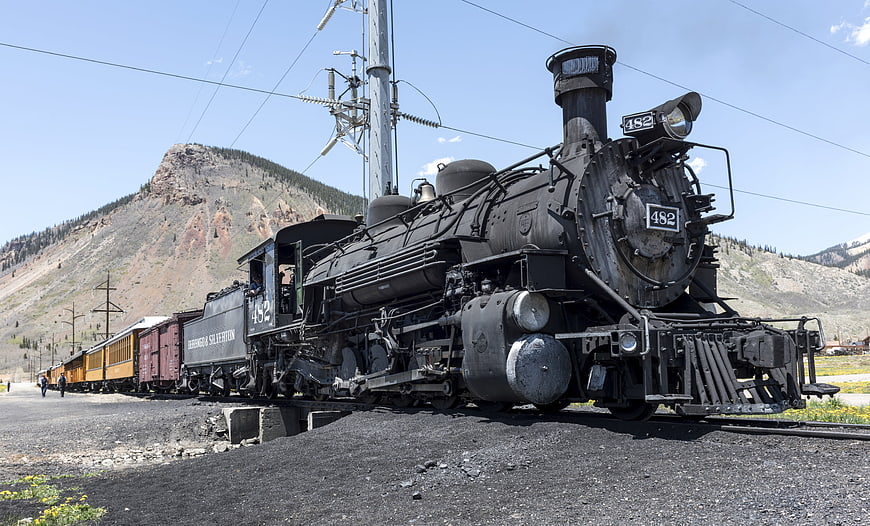 Historic Steam Locomotive 482 on Railroad Tracks in San Juan Mountains