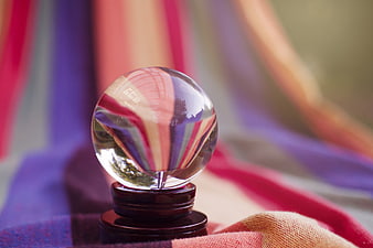 Crystal Ball on Colorful Fabric Background