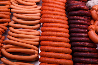 Assorted sausages and salami at a market display