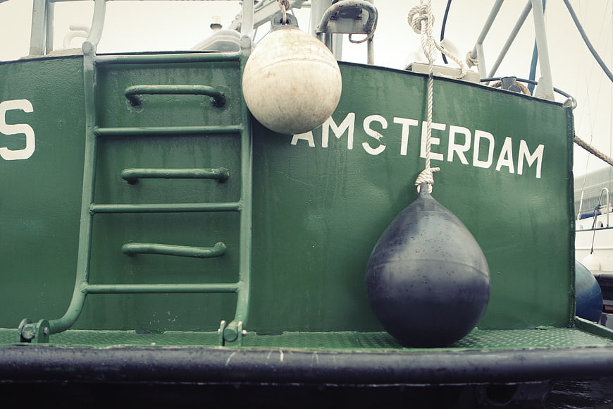 Green Fishing Boat Hull with Amsterdam Text and Buoys