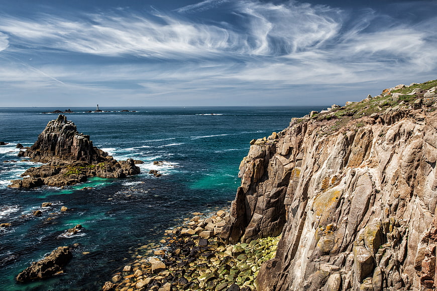 Dramatic Cornish Coastline With Rocky Cliffs And Turquoise Ocean