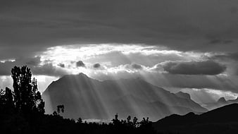 Dramatic Black and White Mountain Landscape with Sun Rays