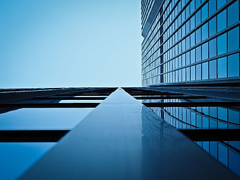 Low angle view of modern glass skyscraper architecture