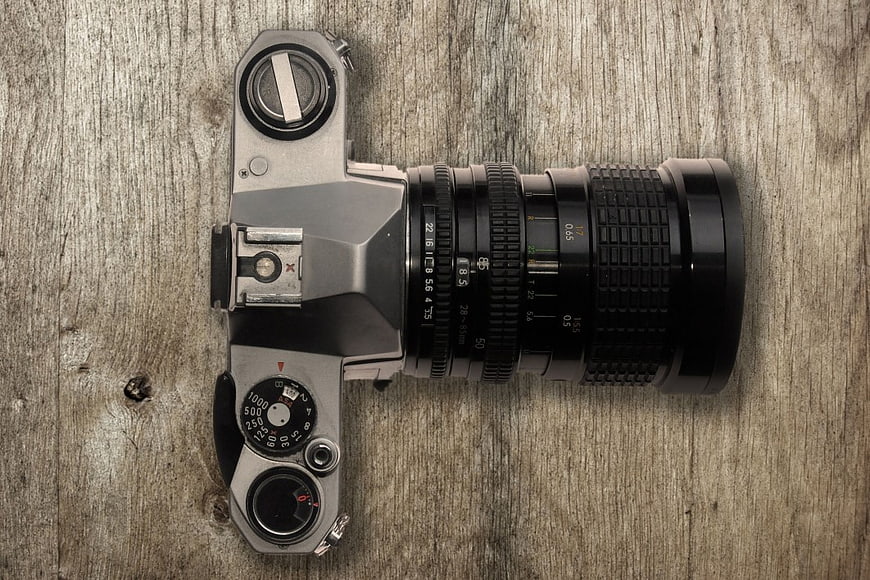 Vintage SLR Camera on Wooden Background