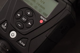 Close-up of camera flash trigger control panel and buttons