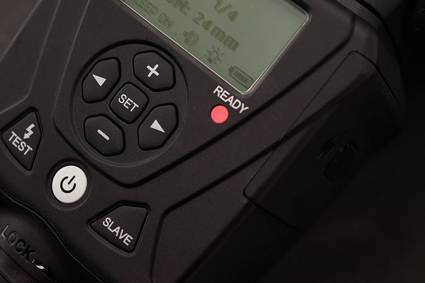 Close-up of camera flash trigger control panel and buttons