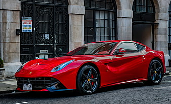 Red Ferrari F12 Berlinetta Parked on Urban Street