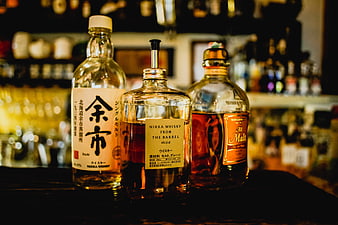 Three Japanese Whisky Bottles on Bar Counter