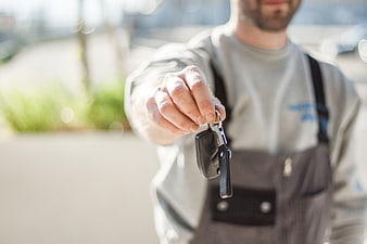 Mechanic Handing Over Car Keys to Customer
