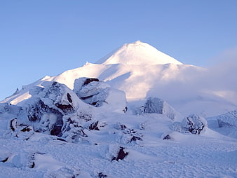 Snow-Covered Volcano Peak in Kamchatka Winter Landscape