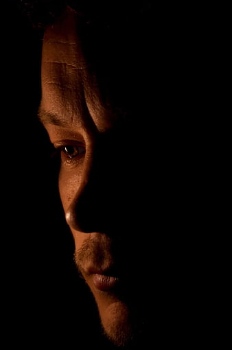 Dramatic Close-Up of Man's Face in Shadow