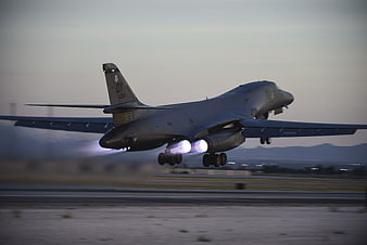 B-1B Lancer Bomber Taking Off With Afterburners At Dusk