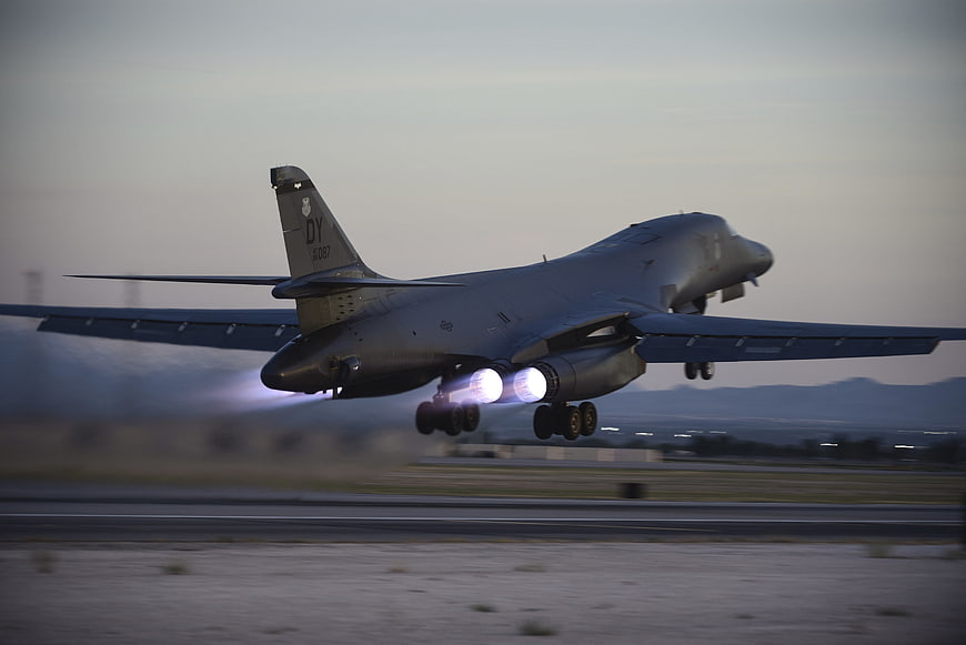 B-1B Lancer Bomber Taking Off With Afterburners At Dusk