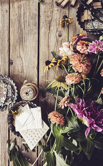Rustic Flat Lay of Vintage Flowers and Craft Supplies on Wood