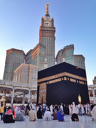 Kaaba and Makkah Clock Tower with Pilgrims in Mecca
