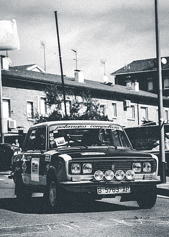 Vintage Rally Car on Urban Street Black and White