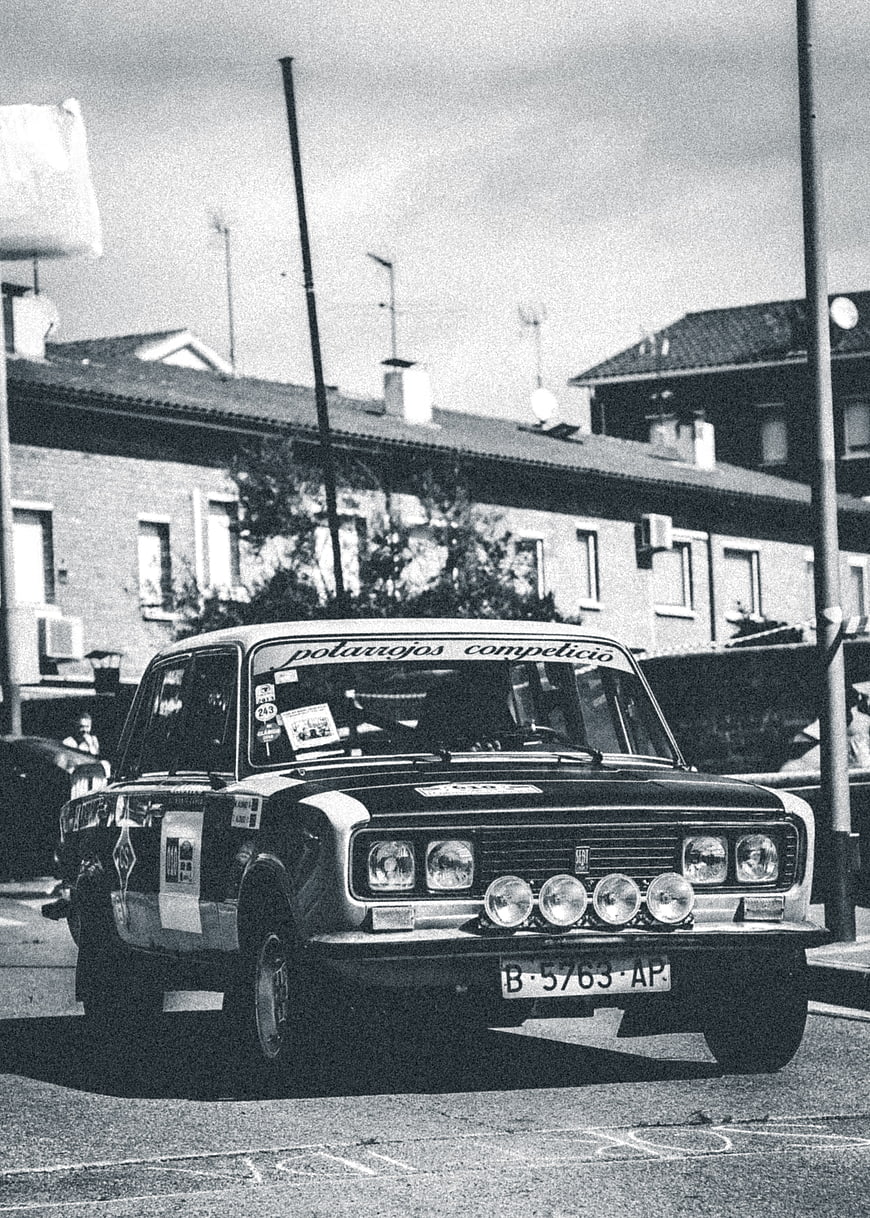 Vintage Rally Car on Urban Street Black and White