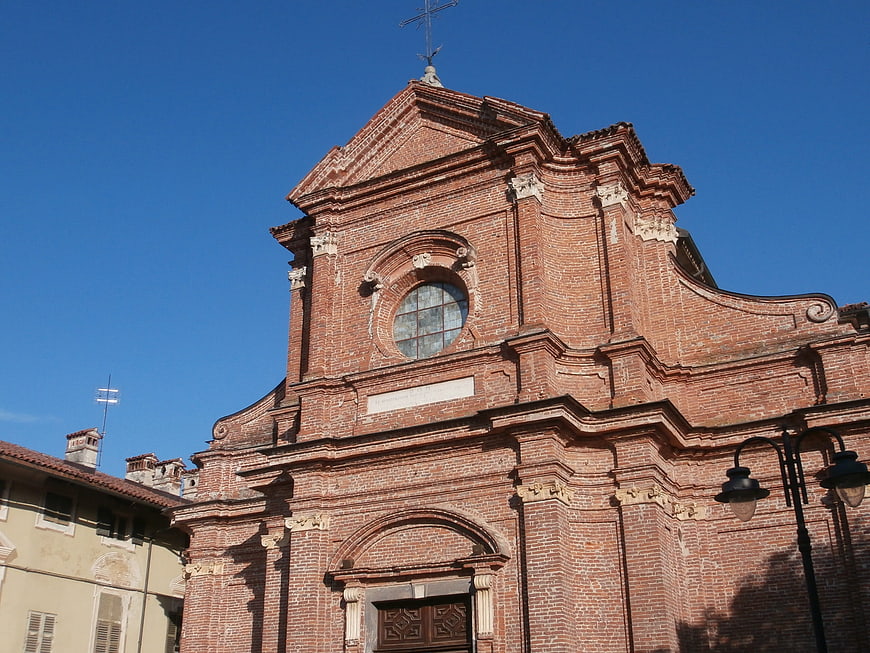 Red Brick Church Facade Against Blue Sky