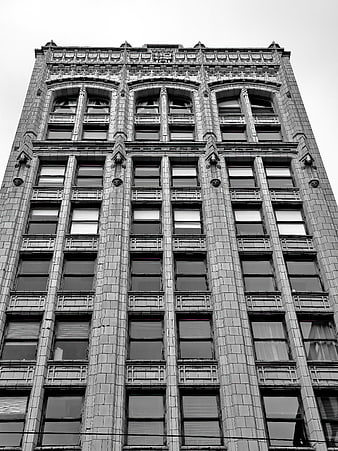 Black and white low angle view of ornate historic building facade