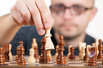Man Playing Chess Strategy Game Concept