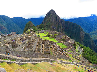 Machu Picchu ruins with Huayna Picchu mountain background