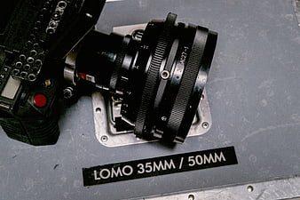 Close-up of vintage Lomo camera lens on metal surface