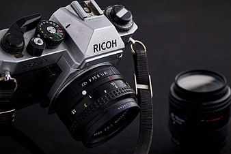 Vintage Ricoh KR-10 SLR Camera with Lens on Dark Background