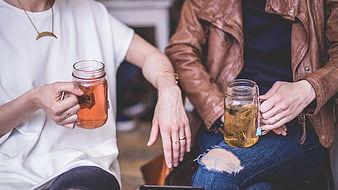 Two Friends Drinking Tea from Mason Jars
