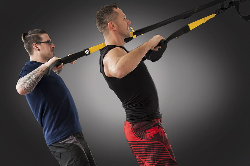 Two Men Performing TRX Suspension Training Workout