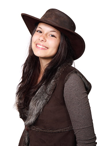 Smiling Woman in Brown Cowboy Hat and Fur Vest