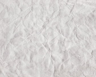 Crumpled white paper texture background with wrinkles and creases