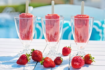 Strawberry Popsicles in Glass Cups with Fresh Berries Poolside