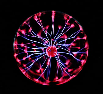 Vibrant plasma ball with electric neon light rays on black background