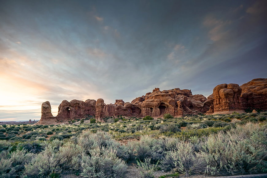 Dramatic Red Rock Formations in Desert Landscape at Sunset