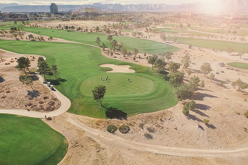 Aerial View of Desert Golf Course with Mountains
