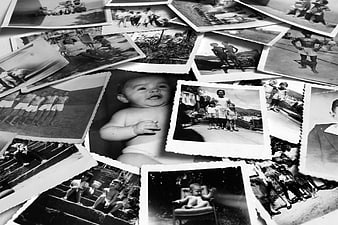 Scattered vintage black and white family photographs collage