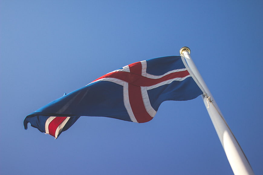 Iceland flag waving against clear blue sky