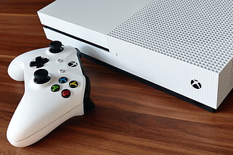 White Xbox One S Console and Controller on Wooden Table