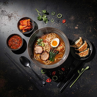 Top View of Spicy Ramen Bowl with Dumplings and Kimchi