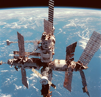 International Space Station Orbiting Earth With Solar Panels