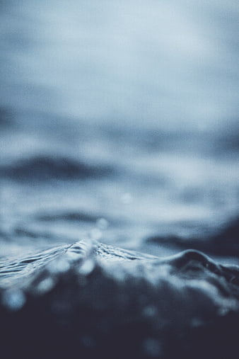 Abstract Blue Ocean Wave Close-Up with Shallow Depth of Field