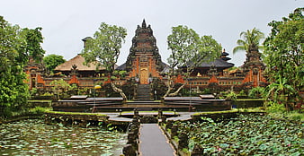 Traditional Balinese Temple with Lotus Pond and Stone Pathway