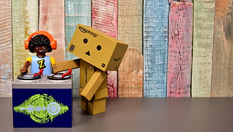 Amazon cardboard robot and DJ figurine with turntable mixer