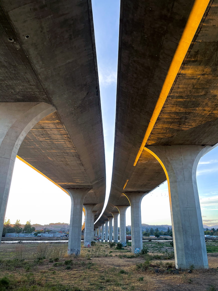 Underneath Concrete Highway Overpass with Golden Hour Light