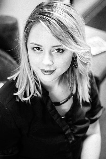 Black and white portrait of a smiling young blonde woman