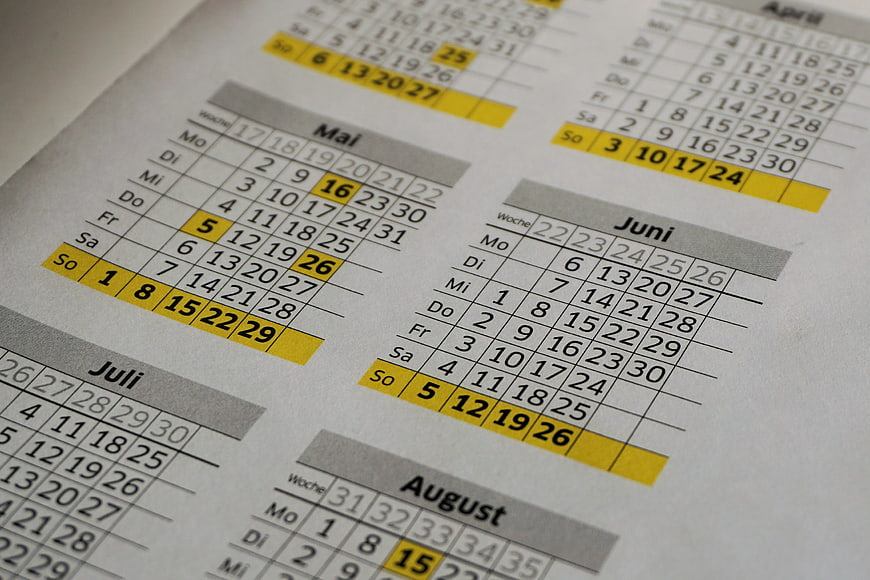 Close-up of German annual calendar with highlighted dates