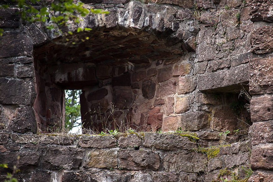 Ancient stone castle ruins with mossy window openings