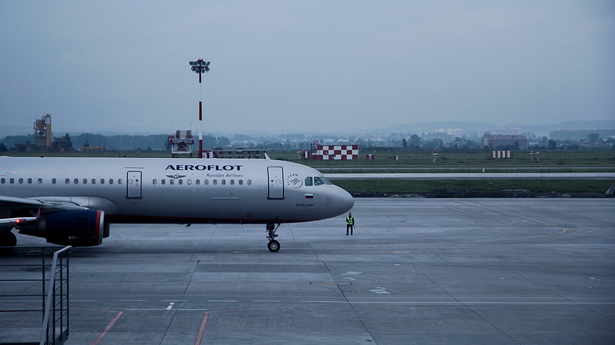 Aeroflot airplane taxiing on wet airport tarmac