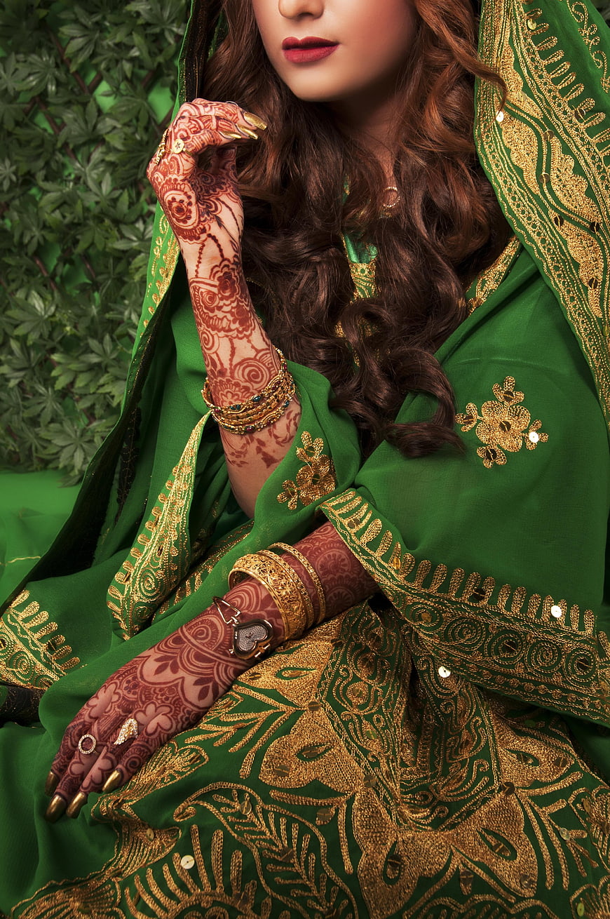 Indian Bride In Green Lehenga With Intricate Henna Hands